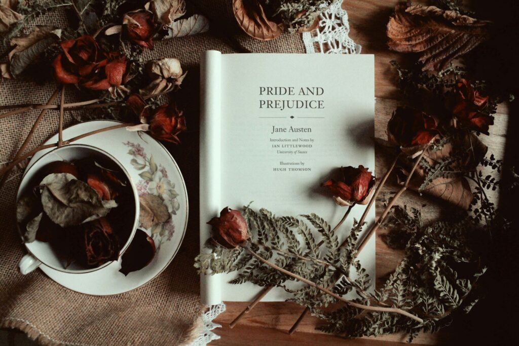 a book sitting on top of a table next to a cup of tea
